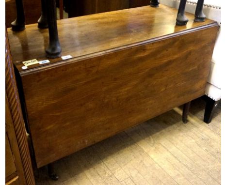 A 19th Century cottage style mahogany drop leaf dining table, raised on column support.