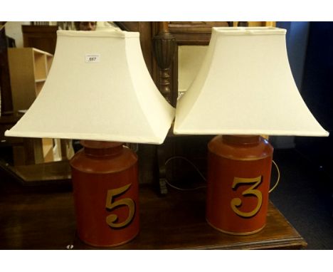 A pair of reproduction table lamps in the form of tea urns produced by Woolpit Interiors of Suffolk.