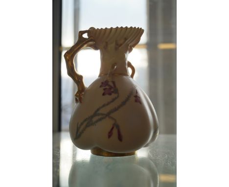 A Royal Worcester blush ivory jug of bulbous form.