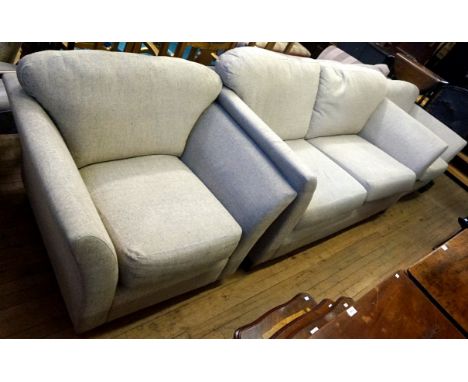 A modern three suite comprising three seater sofa and two matching armchairs.
