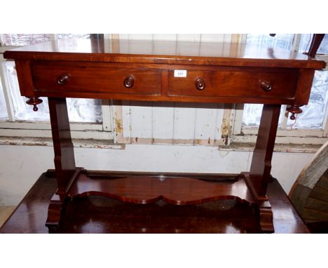 A Victorian mahogany side table having two frieze drawers.