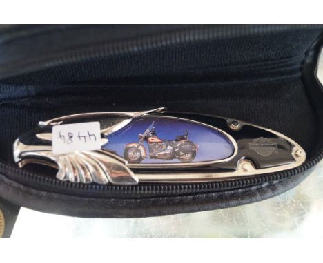 A Franklin Mint Harley Davidson pen knife.