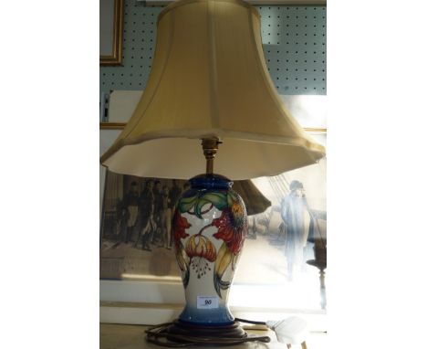 A modern Moorcroft pottery table lamp decorated in the Anna Lily pattern.