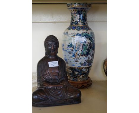 A modern Chinese vase decorated with figures in landscape together with a modern Chinese model of Buddha.