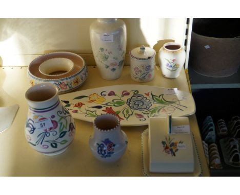 Eight pieces of Poole Pottery each having floral decoration to include a spear, cheese dish and cover etc.
