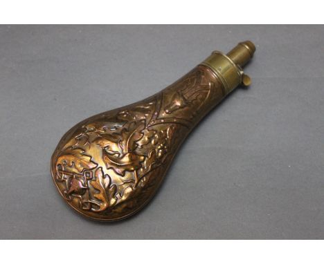 J W Hawksley a copper bodied powder flask, with stag oak leaf and fox decoration, length 27 cm.