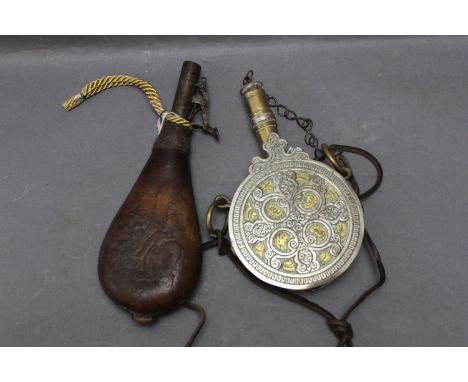 Leather bodied shot flask, embossed with Scottish hunter on horseback, and reproduction Eastern brass flask.