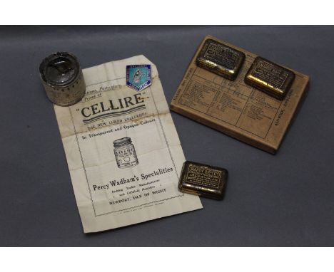An enamel Dumfries &amp; Galloway Angling Association badge, together with three Hardy tins, a Hardy cardboard box containing