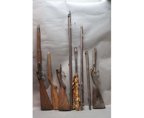 Four shotgun and rifle barrels and 4 part stocks, one barrel marked William Greener Maker 1800 stamped 55 percussion rifled, 
