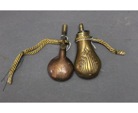 Brass and copper pistol flask, 11 cm, and a copper and brass flask decorated with ducks.  