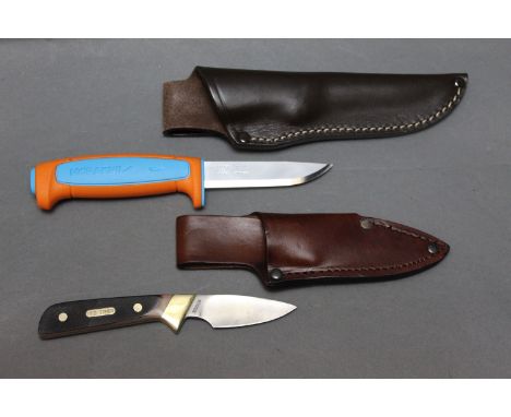 Two fixed blade knives, a Schrade old timer with a 2 3/4" blade and sheath, together with a Mora Kniv knife with 3 1/2" blade
