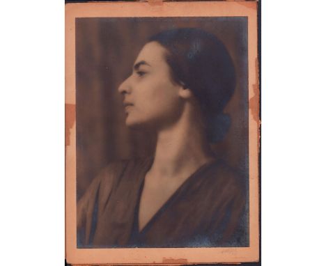 Albumen portrait of an elegant woman looking in a side turn pose.Hand signed in pencil on lower right side. Board size: 8in x