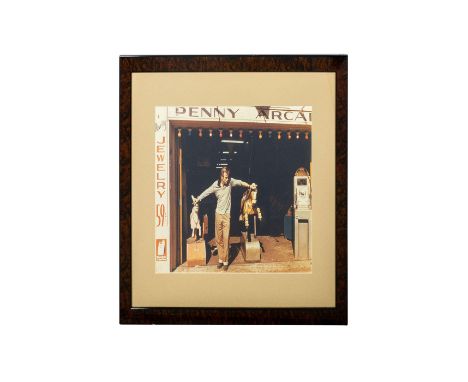Vintage print of James Dean at the Penny Arcade. Framed and matted behind glass: 18.5in H x 22.5in L Issued: 1950â€™sCountry 