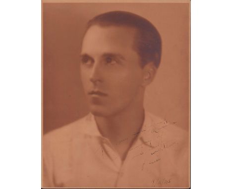 Portrait depicts young Caucasian man looking up in a quarter turn pose with Rembrandt-like lighting.Sepia toned portrait phot