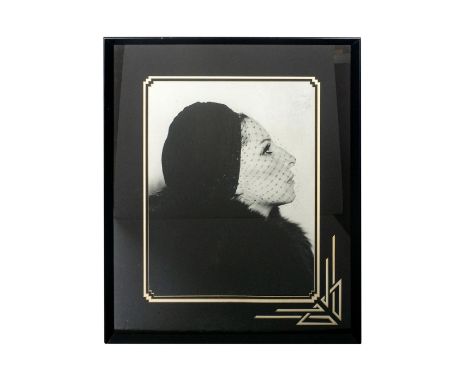 Black and white print of Barbara Streisand. Framed in a black frame with triple matting in an intricate deco style cut. 27.5i