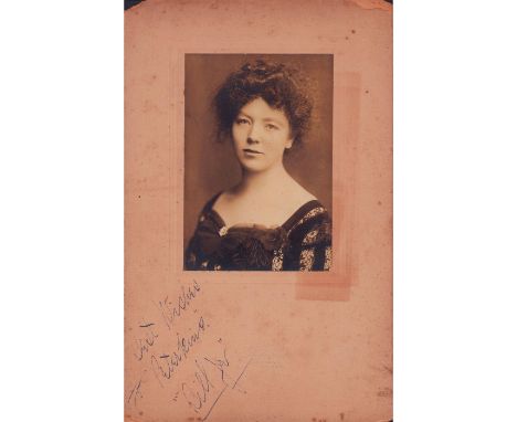 Sepia toned soft focus portrait of dark haired woman in a dark lacey dress. Albumen print on textured cardstock.Legible handw