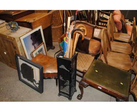 A lacquered stick stand and contents of walking sticks, umbrellas, golf clubs etc. 