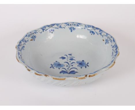 A blue and white Delftware bowl having shaped border and fluted body, 28.5cm