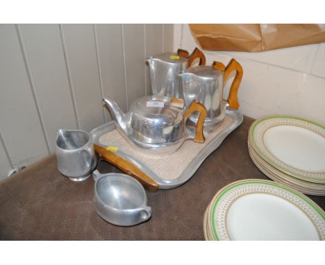 A Picquot ware tea set on tray and a similar cream jug and sugar bowl