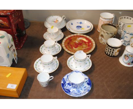 A Royal Crown Derby cabinet plate decorated exotic birds; two 19th Century floral decorated plates; a Rockingham style tea cu