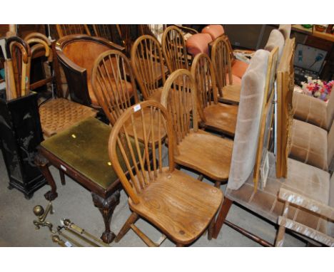 Seven elm seated stick back dining chairs, one with War Department mark