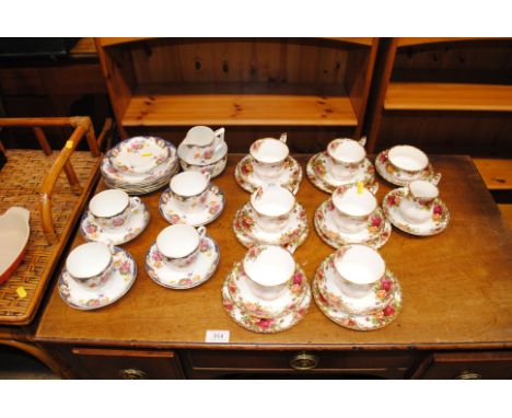A quantity of Royal Albert 'Old Country Roses' trios, cream jug and sugar bowl, together with a quantity of floral decorated 