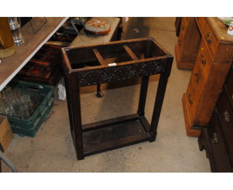 An early 20th Century oak carved three division stick stand 