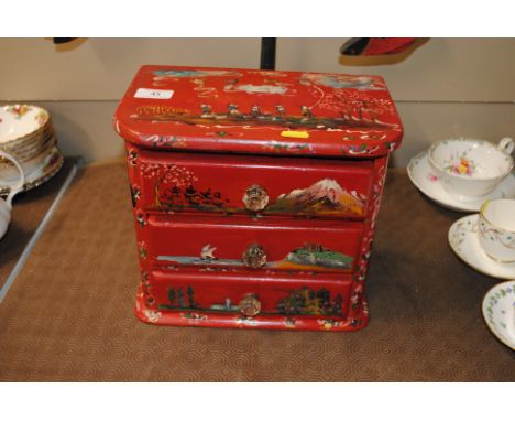 A painted trinket chest fitted three drawers with glass handles 