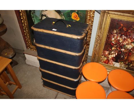 A wooden and metal bound travelling trunk