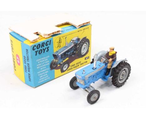 Corgi Toys No. 67 Ford 5000 Super Major Tractor finished in blue with grey hubs and driver figure, complete with packing card