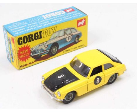 Corgi Toys No. 345 MGC GT competition model comprising of a yellow and black body with wirework hubs, sold in the original bl