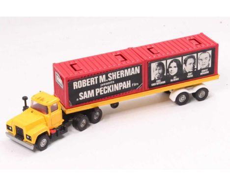 Corgi Toys No. 1106 Mack Container Truck in yellow with red containers, the containers have had advertising for the film "Con