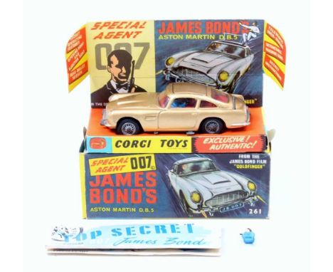 A Corgi Toys No. 261 James Bond's Aston Martin DB5 comprising of gold body with red interior, housed in the original sliding 