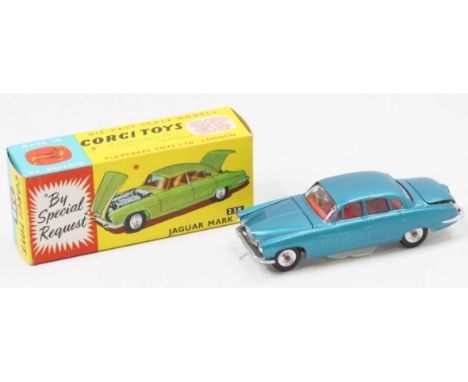 A Corgi Toys No. 238 Jaguar Mk 10, comprising of metallic deep blue body with red interior and spun hubs, with two luggage pi