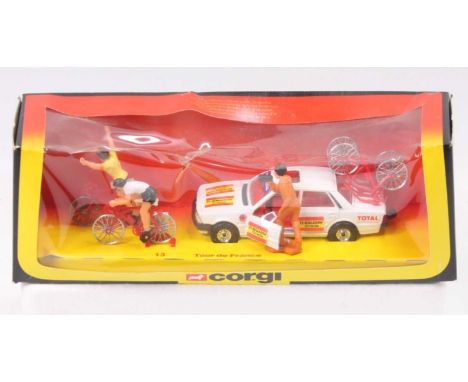 Corgi Toys Gift Set 13 Tour De France comprising Peugeot managers car with spare cycles following 2 cyclists, the box window 