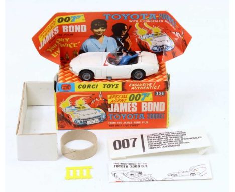 A Corgi Toys No. 336 James Bond's Toyota 2000 GT comprising of white body with black interior, and two figures, fitted with w