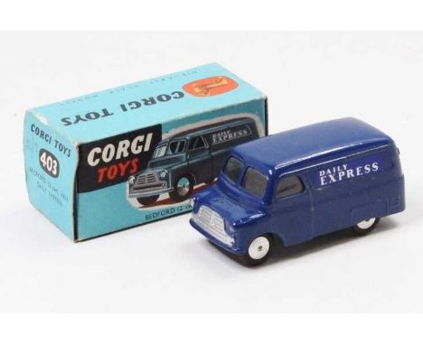 A Corgi Toys No. 403 Bedford 12 cwt Daily Express delivery van comprising of dark blue body with flat spun hubs and Daily Exp