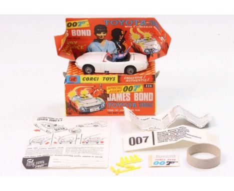 Corgi Toys No. 336 James Bond's Toyota 2000 GT comprising of a white body with black interior, and two figures, fitted with w