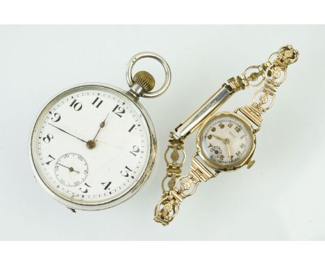 9ct gold cased Winegartens ladies wrist watch having a round face with Arabic numerals to the chapter ring mounted to a gold 