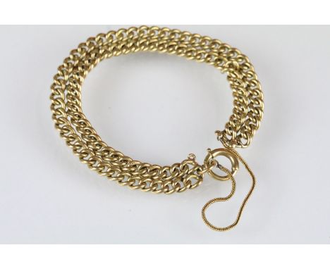 18ct gold double curb link bracelet with spring ring clasp and wheat link safety chain. Measures 7 inches. 