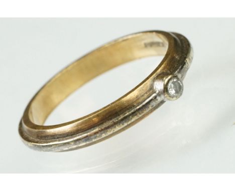 9ct gold two tone band ring bezel set with a diamond to centre. Hallmarked London. Size P. 