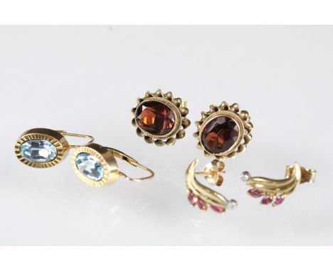 Three pairs of 9ct gold earrings to include a pair or garnet earring set within a rope twist mount (hallmarked Birmingham 197