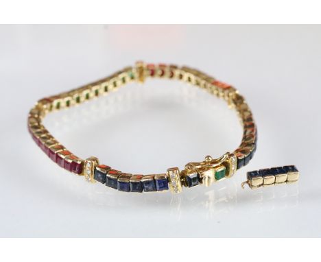 Sapphire, emerald, ruby and diamond line bracelet. The bracelet being set throughout with square step cut stones with five di