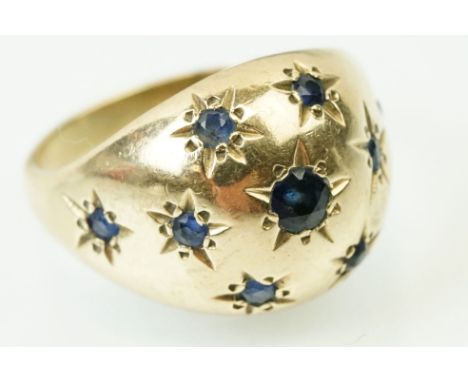 9ct gold hallmarked dome ring set with round cut sapphires star sapphires. Hallmarked London 1981. Size Q. 