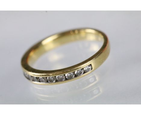 18ct gold and diamond half eternity ring being channel set with round brilliant cut diamonds, estimated 0.50ct in total. Hall