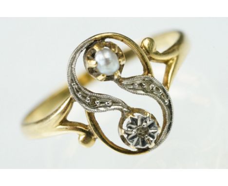 French Art Nouveau early 20th Century 18ct gold ring. The ring having a pierced cross over design head set with an illusion s