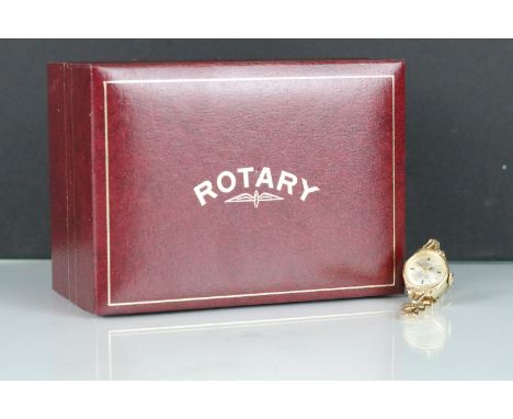 Rotary 9ct gold ladies wrist watch having a round face with baton markings to the chapter ring mounted to a pierced bracelet 