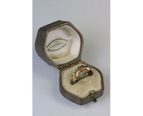 Early 20th Century pearl and turquoise ring. The ring having scrolled details with pearl and turquoise cabochons. Hallmarked 