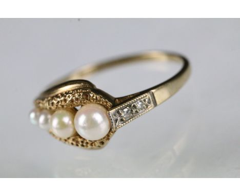 9ct gold and cultured pearl dress ring set with four graduating pearls. Hallmarked Birmingham 1987. Size L. 