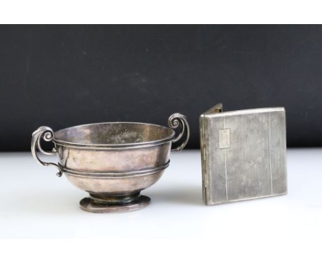Early 20th Century hallmarked silver sugar bowl having scrolled twin handles raised on a pedestal base (hallmarked London, da